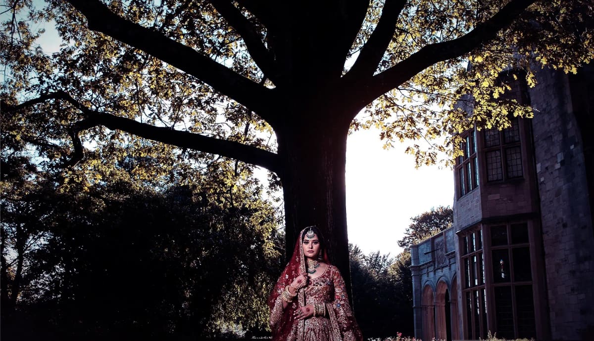 A signature Sri Sakhi silhouette photographed against an ivory wall